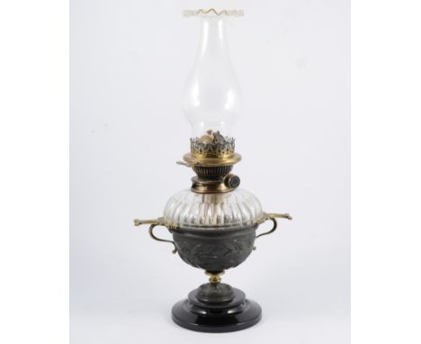 Edwardian oil lamp, facet-cut reservoir, circular base, 30cm, with two associated chimneys.