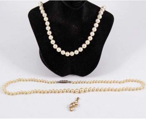 Two cultured pearl necklaces, a necklace of fifty-four 6.8mm pearls, 40cm long with a 750 fastener, a necklace of eighty-six 