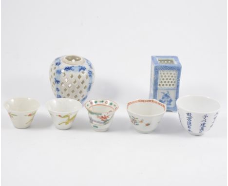 Three Chinese blue and white cricket jars, and a small collection of tea bowls and saucers.