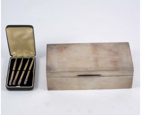 Silver engine turned cigarette and a set of sterling silver bridge pencils.