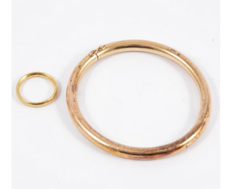 An 18 carat yellow gold wedding band and a plain bangle marked 9c, plain polished hollow 6mm gauge, total weight approximatel