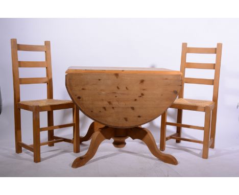 Extending pine kitchen table, oval top with a moulded edge, splayed legs, top 14cm x 91cm, height 72cm; and four beech ladder