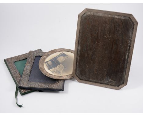 Silver photograph frame, Birmingham 1933, canted corners, engine-turned decoration, 30cm x  22cm; an oval silver photograph f