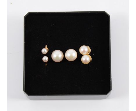 Three pairs of pearl stud earrings - 8.4mm, 6.2mm, 4mm, all with pierced fittings.