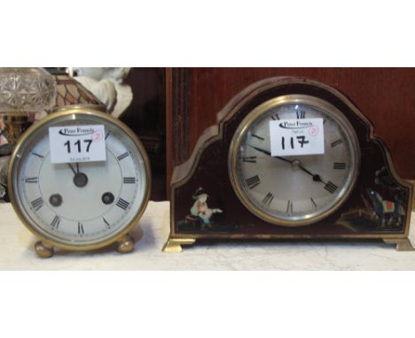 Brass two train drum shaped mantel clock with top glass and white face with Roman numerals on two ball feet. 9.5cm diameter a