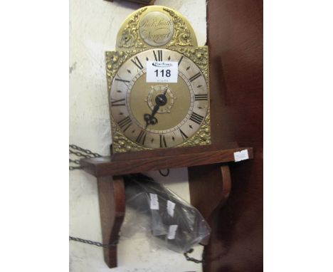 Modern small brass lantern clock with Roman silvered chapter ring, marked to the arch 'Rich. Smith, Newport' on an oak bracke