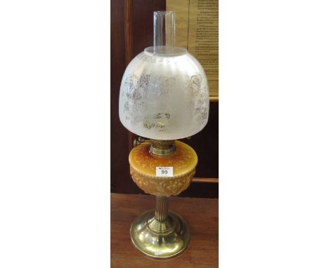 Early 20th Century brass double burner oil lamp with coloured glass relief decorated reservoir on brass pedestal base, etched