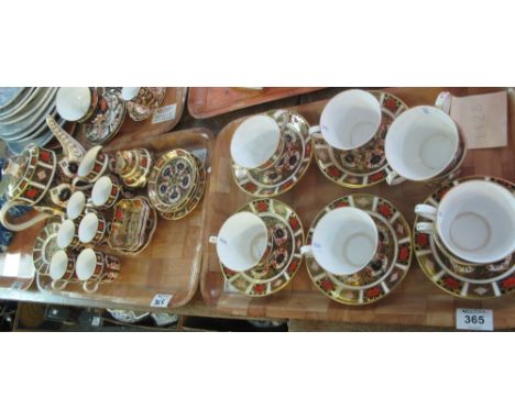 Two trays of Royal Crown Derby English fine bone china Imari design items to include; coffee cans and saucers, teapot, cups a