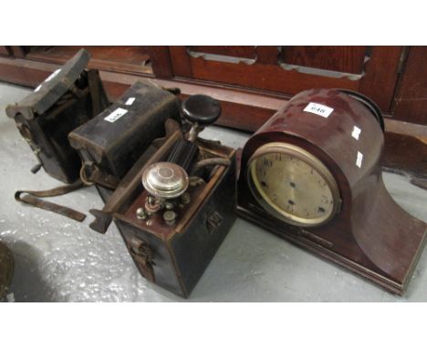 Three leather cased early 20th Century engineers Ericsson field telephones, together with a hat shaped mantel clock.(B.P. 24%