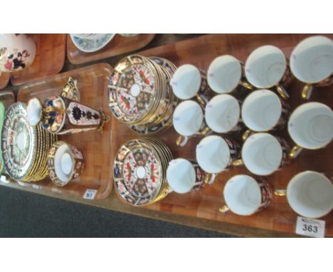 Two trays of Royal Crown Derby Imari design items to include; coffee cups and saucers, side plates, two handled vase, sucrier