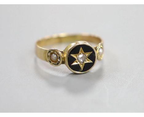 A Victorian yellow metal black enamel, seed pearl and diamond set mourning ring, size O/P, gross weight 2.3 grams.