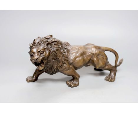 A bronze lion, bearing a signature, Rodin, 31cm.