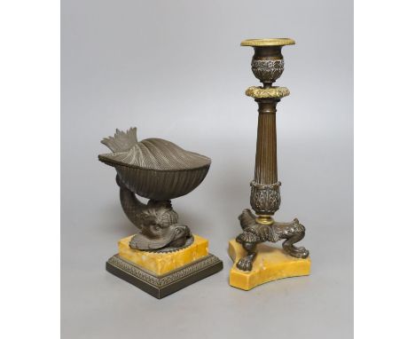 A 19th century bronze dolphin inkstand, 15cm. high, and a similar candlestick, on Sienna marble bases