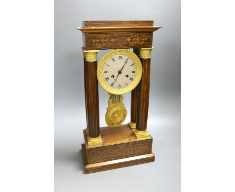 A French rosewood portico clock, with pendulum, no key, 44 cms high.