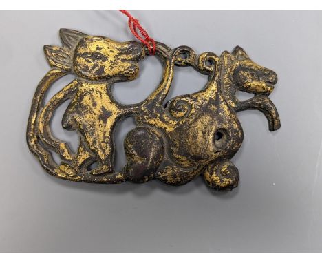 A Chinese gilt bronze plaque, 12cm. wide
