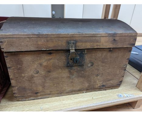 A domed trunk containing flat irons, elm cash-tray etc