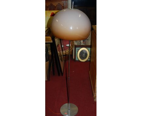 A 1980s Italian style chrome standard lamp with domed plastic shade