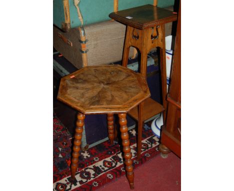 A 1930s oak square section two tier plant stand, together with a burr walnut octagonal topped bobbin turned occasional table,