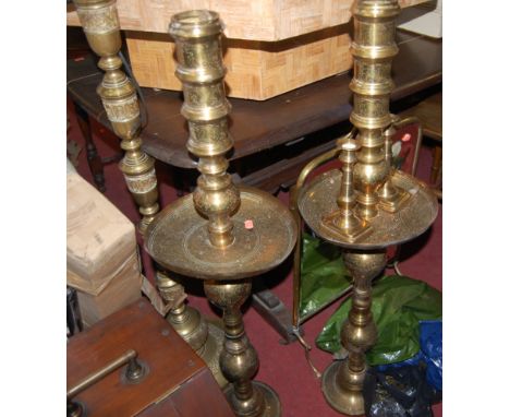 A pair of Eastern brass freestanding candlestands and an Eastern brass table lamp, carved walnut coal purdonium, brass and mi