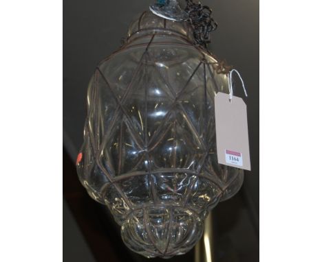 A blown glass and metal framed Hundi ceiling lamp