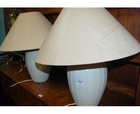 A pair of modern glazed ceramic table lamps, with shades 