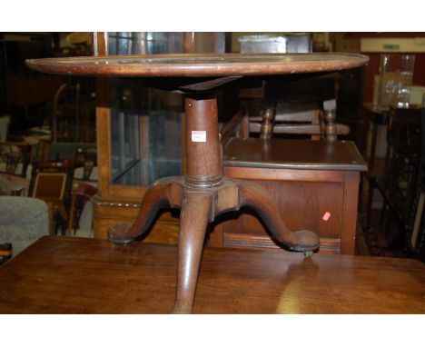 A 19th century mahogany fix top low pedestal tripod table (with alterations and repairs)