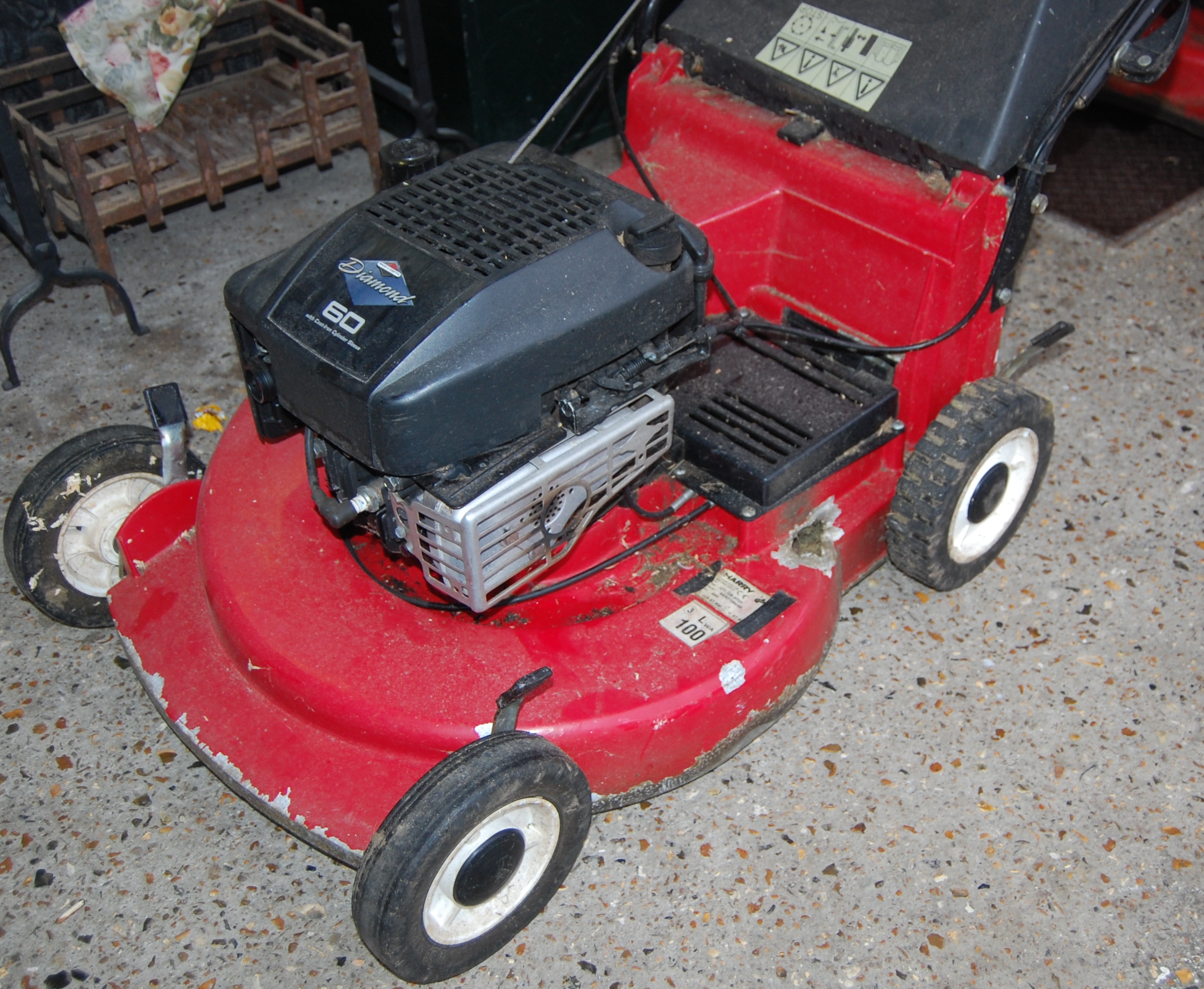 A Briggs & Stratton Diamond 60 petrol driven lawn mower with grass ...