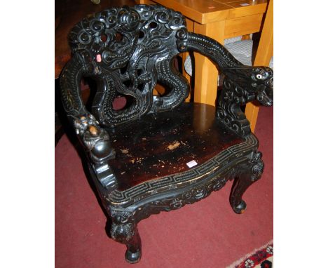 A Chinese stained and carved panel seat open armchair