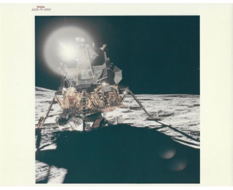 Alan ShepardA front view of the Lunar Module with a large circular flare caused by a reflection of the sun behind the spacecr