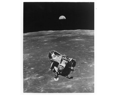 Michael CollinsLunar Module 'station-keeping' in rendezvous orbit with Earth rising above the lunar horizon and Lunar Module 