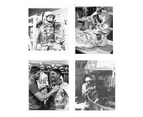 NASAA group of four images, comprising:1) Walter Schirra undergoes test in weight and balance machine at Hangar "S" ahead of 