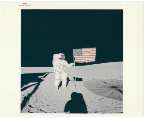 Edgar MitchellAlan B. Shepard stands beside the deployed US flag on Fra Mauro Highlands in the early stages of the first EVA.