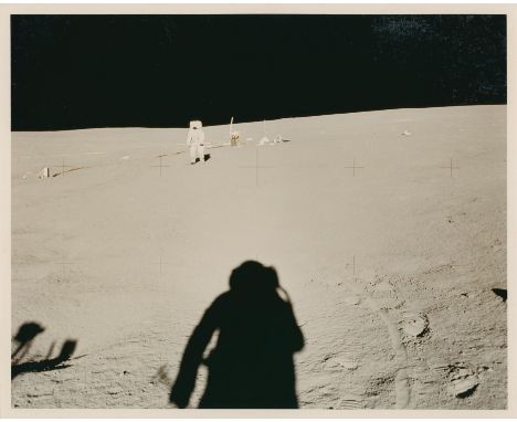 Alan ShepardEdgar Mitchell walking back to the LM from the ALSEP site, the shadow of the photographer seen on the lunar soil3