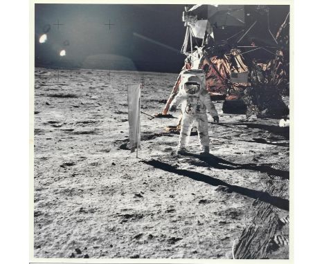 Neil ArmstrongBuzz after the deployment of the Solar Wind Collector. Cable tracks and boot prints are clearly visible in the 