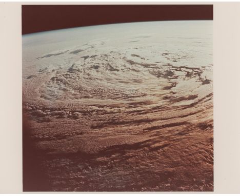 Michael CollinsView of the Earth illuminated by the morning sun.A majestic view showing a low pressure cell in the ocean illu