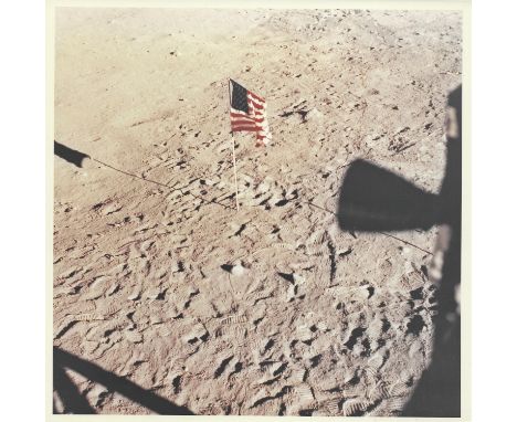 Buzz AldrinThe American flag, footsteps and portions of the Lunar Module seen from the window after the successful EVA20 July