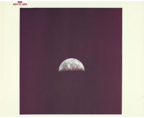 Thomas Stafford, Gene Cernan or John YoungView of approaching Earth as seen during transearth injection. The Arabian Peninsul