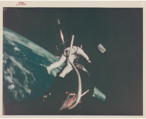 NASABuzz Aldrin at the Agena work station during his EVA over the Earth. The photograph is a still from a 16 mm Maurer camera