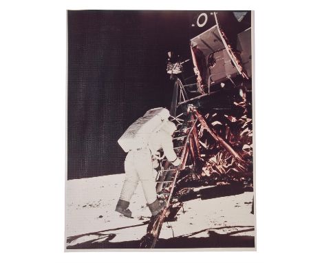 Neil ArmstrongBuzz Aldrin walks down the ladder as he prepares to take his first steps on the surface of the Moon20 July 1969