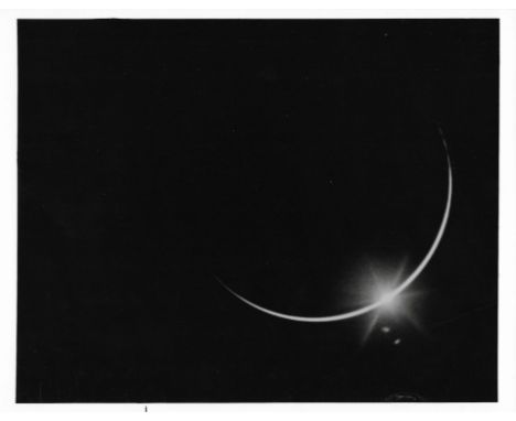 Alan Bean, Charles Conrad or Richard GordonThe sun fades in eclipse behind Earth's disc as Apollo 12 astronauts head home14-2