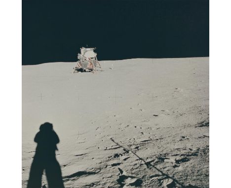 Neil Armstrong A view of the Lunar Module from the Little West Crater, the furthest traversed during the EVA. The shadow of N