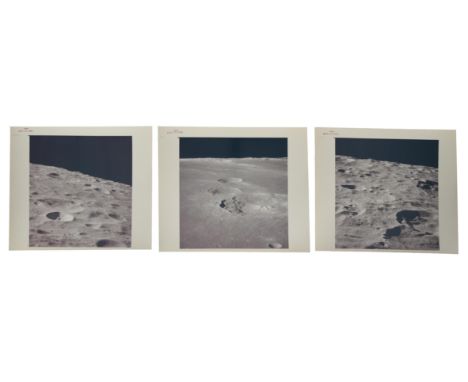 John Young, Ken Mattingly or Charles DukeA group of three orbital views of the lunar surface, taken after the docking of the 