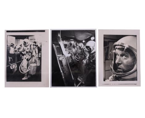 A group of three photographs showing pre-launch preparations, comprising:1) Walter Schirra shakes hands with an onlooker whil