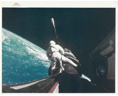 Charles Conrad A remarkable image of Gemini 11 Pilot Richard Gordon attaching a tether line from his spacecraft to the Agena 