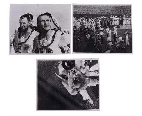 NASAA group of three images of James Lovell and Frank Borman during recovery, comprising:1) After splashdown Frank Borman is 