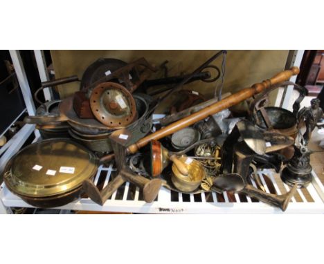 A shelf full of metal wares to include shoe lasts, saucepans, copper kettle etc