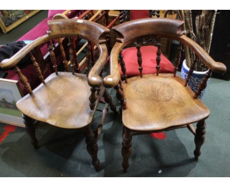 A pair of early 19th century smokers bow armchairs stamped Dowler, Warwickshire cabinet makers. Ash and elm&nbsp;