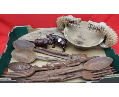 A collection of carved wood Tribal items, includes a protective, Opal Eye Fetish mask, a bowl with carved crocodile decoratio