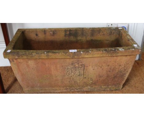 An oblong terracotta garden planter