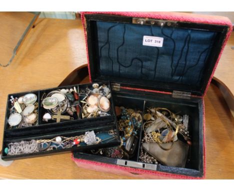 A jewellery box containing a wide selection of vintage and costume jewellery